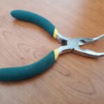 cyan colored bent nose pliers